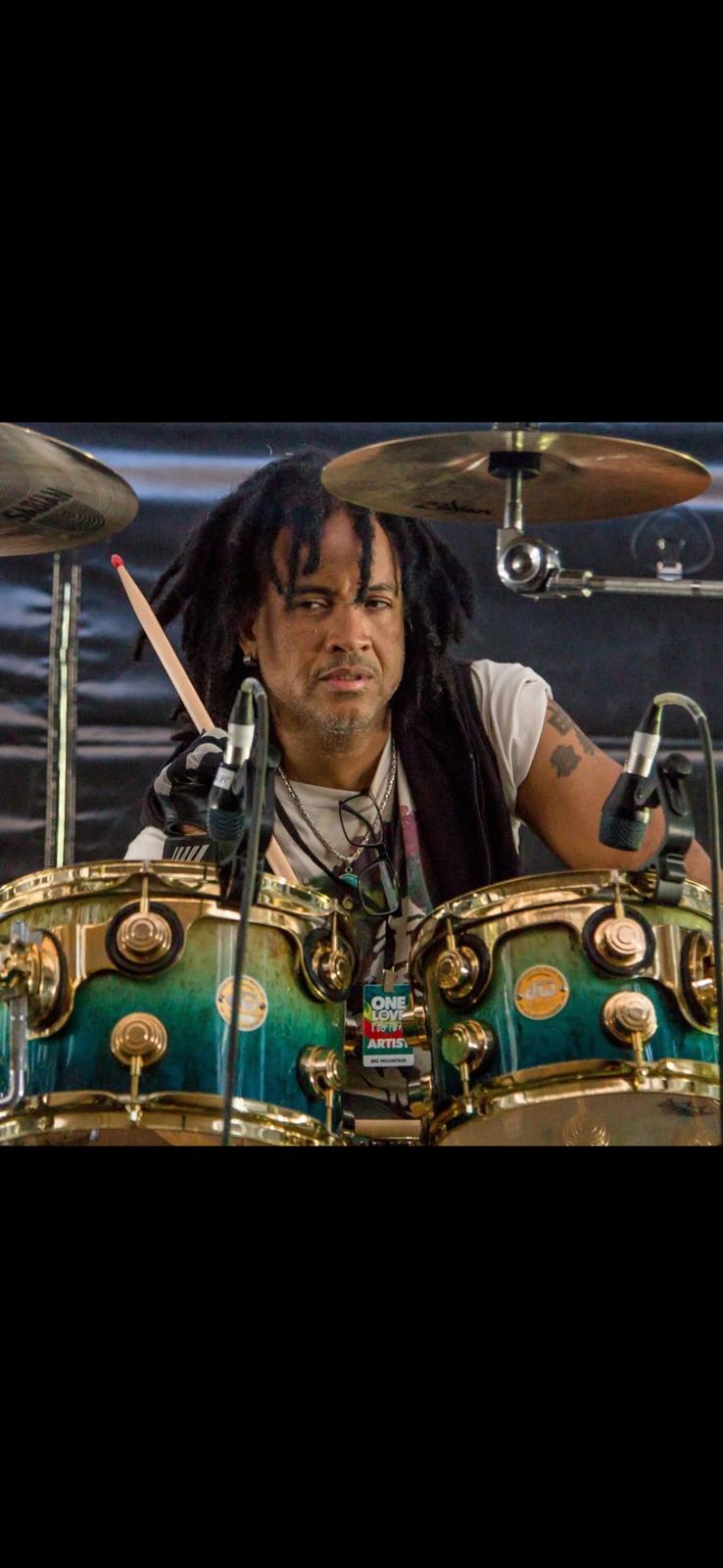 Close-up of Paul KasticK playing drums