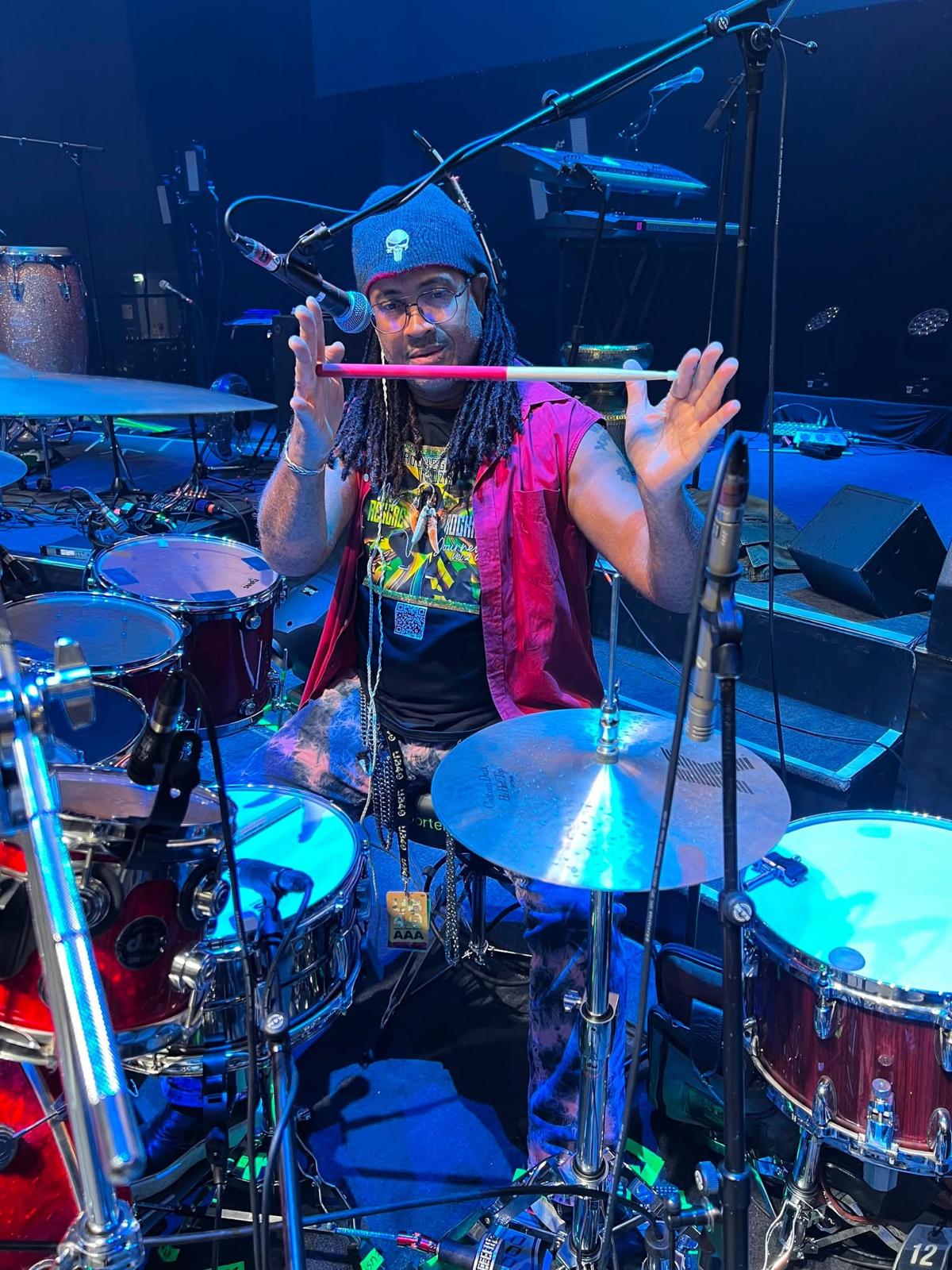 Paul KasticK performing on blue drums